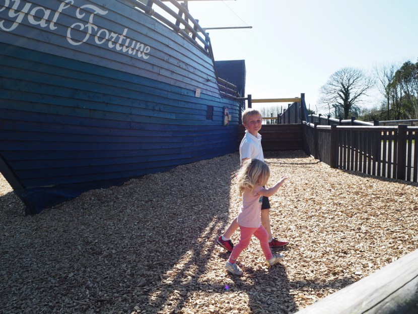 Girl playing on pirate ship at Folly Farm